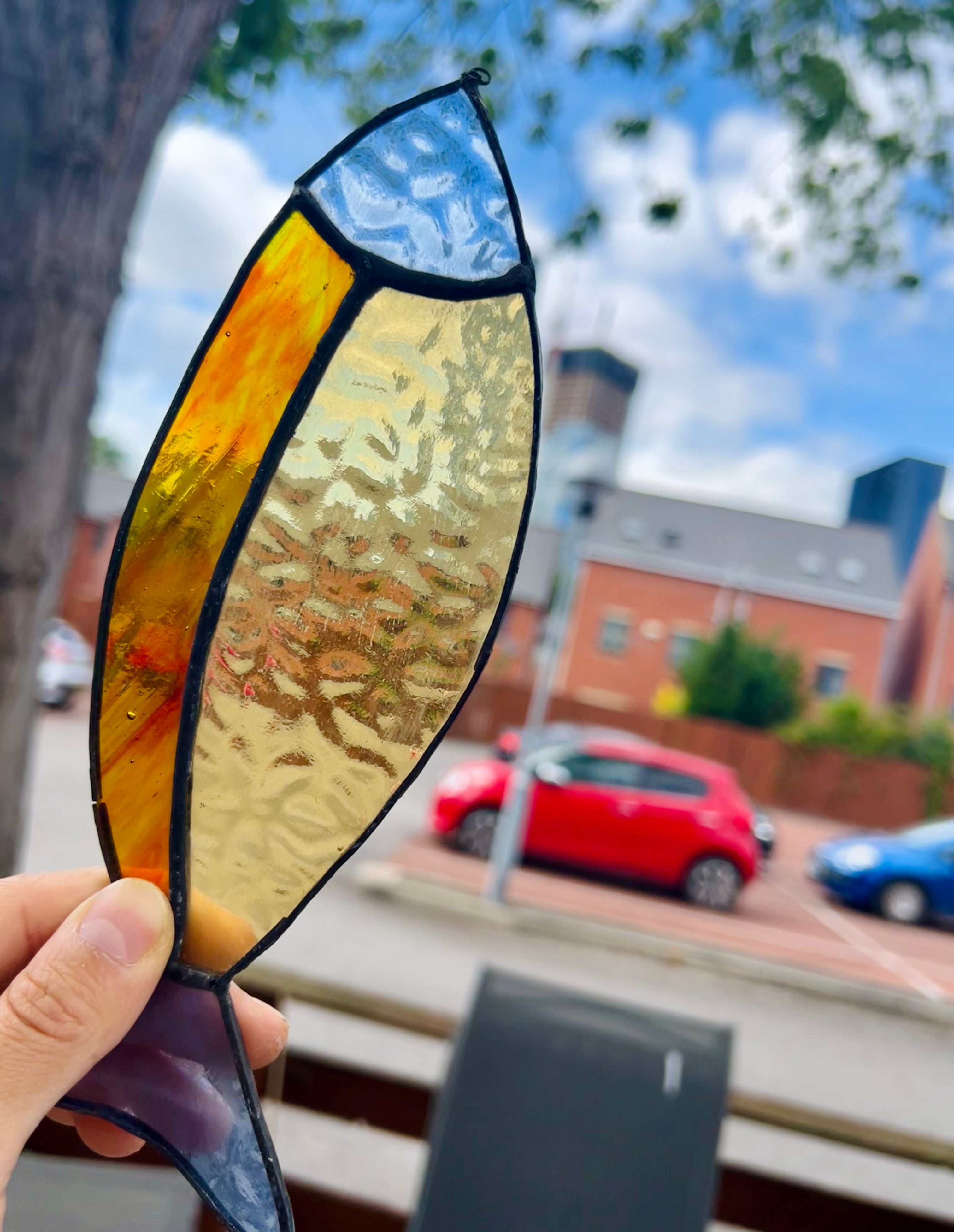 Black edges Stained Glass Fish suncatcher – Firey orange, yellow, sky blue
