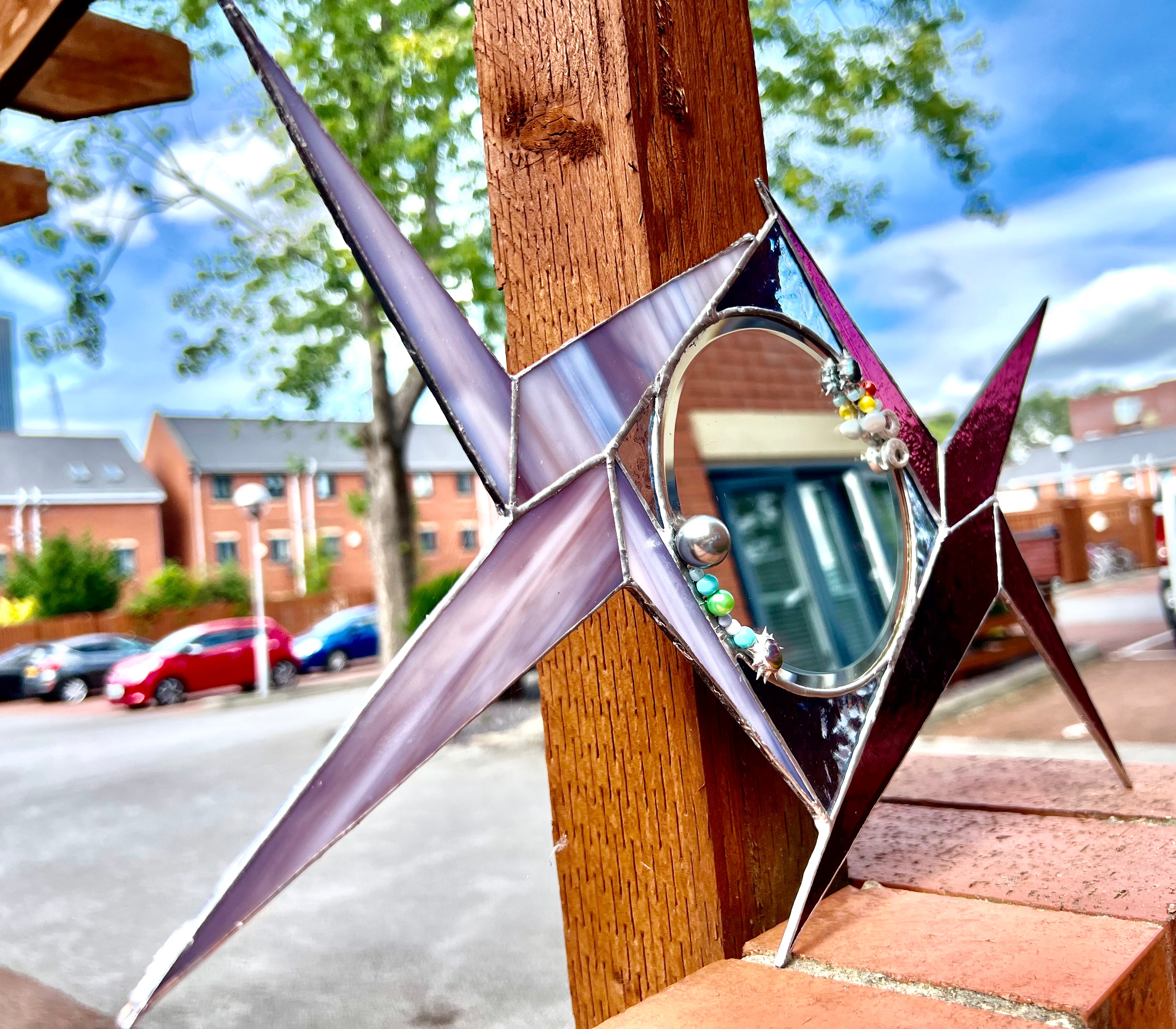 Groovy Starburst Mirror – Retro 60s Vibe with Purple Stained Glass